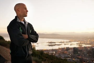 Canvas Print - Man, thinking and fitness with city on mountain for sunrise, workout or outdoor exercise in nature. Male person or athlete with arms crossed in wonder or confidence for training or running on mockup