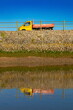 Colourful mini truck reflected on the water