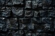 a black stone wall with many square stones