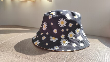 Black bucket hat with daisy pattern