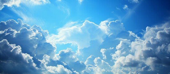 Wall Mural - tranquil blue sky with fluffy white clouds on a sunny day for relaxing landscape background