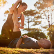 © Katie/peopleimages.com - Nature, help and couple stretching for fitness, workout coach and physio for healthy body. Exercise, wellness and woman with man in muscle warm up for outdoor training in morning on forest ground.