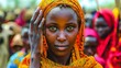 Unidentified Somalian woman in orange dress at the Somalia central market.