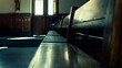 Silent witnesses: Empty benches in a courtroom echo the absence of spectators during a break in proceedings.