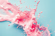 A splash of pink yoghurt with strawberries on a blue background
