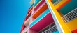 © TheWaterMeloonProjec - Vibrant multi colored building standing tall against the bright blue sky