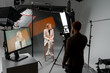 © Big Shot Theory - Photographer capturing woman on stool in studio