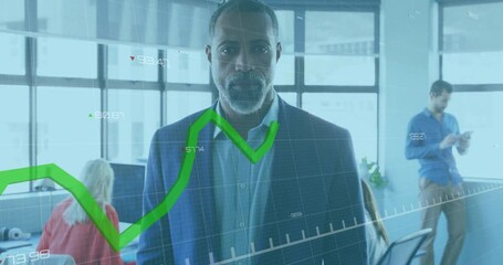 Wall Mural - Animation of green graph over senior african american casual businessman smiling at office