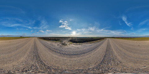 Wall Mural - hdri 360 panorama on gravel road among fields in spring evening with awesome clouds in equirectangul