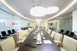  Bright conference room in office of Moscow Stock Exchange: glass walls, long table with microphones