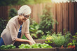 © Irina - Smiling senior woman working in garden. an elderly woman grows vegetables in the garden