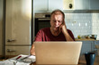 © Marko Geber - Stressed man going over bills at home