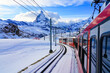 View of the Matterhorn from a window of the cogwheel train of the Gornergrat Railway descending towards Zermatt in the Swiss Alps in winter, Canton of Valais, Switzerland