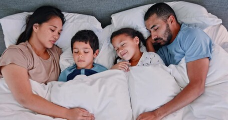 Canvas Print - Happy family, sleeping and relax with cuddle on bed for comfort, rest or weekend together above at home. Top view of mother, father and children asleep under duvet sheets or comforter in bedroom