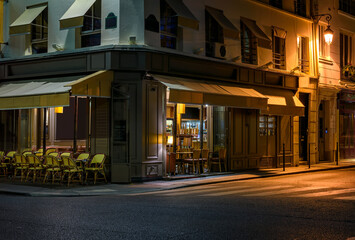 Wall Mural - night view of cozy street with tables of cafe in paris, france. architecture and landmarks of paris.