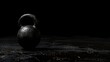 © Artyom - A lone black kettlebell on a textured surface, symbolizing strength and physical fitness