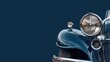 Vintage car headlight detail, classic elegance with a deep blue hue