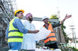 © Jack Tamrong - Arab developer businessman with Caucasian builder and architect man in construction site
