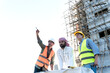 © Jack Tamrong - Arab developer businessman with Caucasian builder and architect man in construction site