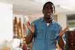 © JackF - Portrait of disappointed african-american man standing in apartment during repair works and gesticulating.