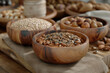 Various croup or grains in wooden bowls on table, selective focus on bowls
