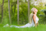 Fototapeta Tulipany - woman lay on green grass