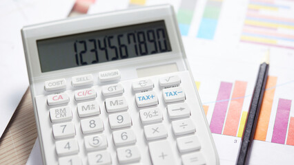 Desk with calculators for calculating, managing and
analyzing economic profits and losses.