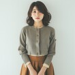 Pretty Young Japanese Woman in Cropped Cardigan and A-Line Skirt, with a relaxed pose photo on white isolated background
