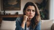 © Arceli - Angry frustrated italian young female woman staring at the camera on a living room home background from Generative AI
