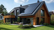 Solar panels on the gable roof, New modern eco friendly passive house with a photovoltaic system on the roof.