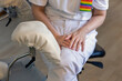 © Johnér - Midsection of female gynecologist sitting on chair in clinic