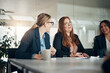 © Flamingo Images - Smiling group of businesswomen talking during an office meeting together
