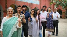 A group of happy voters standing in a queue - thumbs up gesture  new and old voters  responsible citizens. Active voters of different age feeling happy after casting their vote during elections - g...