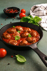 Wall Mural - .Meatballs with tomato sauce and basil in a frying pan