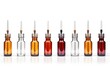 Small bottles with various colored liquids, suitable for scientific or educational concepts