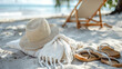 © Jasmina - Wooden chair with straw hat, book and flip flops on the sand beach. Holiday, vacation