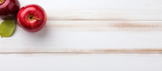 Poster - Two Fresh Apples Resting on a White Wooden Surface in Natural Sunlight