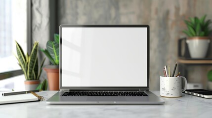 Minimalist workspace desk with laptop and supplies, copy space, business concept, blank screen laptop, office essentials