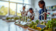 © Robert Kneschke - Engaging school scene with children learning about renewable energy and sustainability