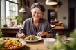 Healthy Lifestyle: Joyful Senior Woman Enjoying a Fresh Salad at Home