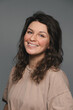 © kazantsevaov - Portrait of a young beautiful woman with curly hair, she is happy and smiling.