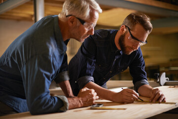 Wall Mural - Family, father and son in a workshop, architect and woods with drawing or safety glasses with protection. Parent, men or teamwork with construction or building with planning for project or renovation