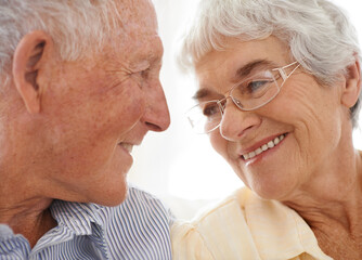 Canvas Print - Couple, senior and happy or love in looking, home and relax together for bonding and smile. Elderly people, romance and care in marriage or relationship in retirement, closeup and security in house