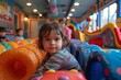 © svastix - Portrait of a toddler with expressive eyes resting on a bright, soft gym mat at a kids' play center