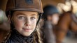 girl kid at equitation lesson looking at camera wearing horse riding helmet