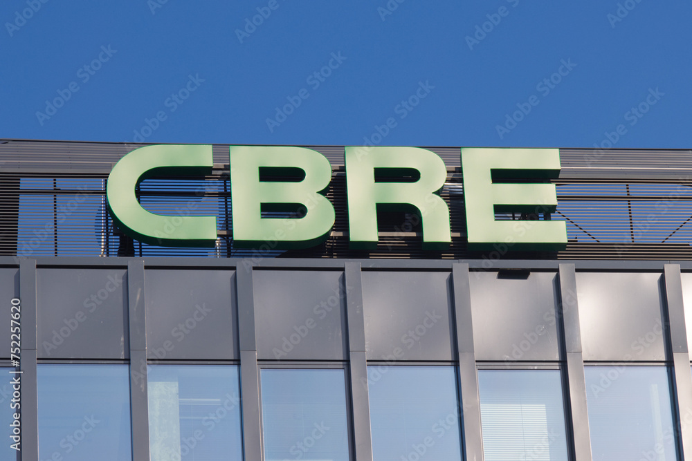 CBRE logo sign at their office. Stock Photo | Adobe Stock