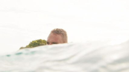 Poster - Portrait of the surfer in the ocean in the Maldives