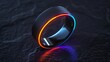 Black smart ring with glowing red and blue accents on dark background