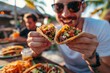 a man eating tacos in summer at outdoor mexican restaurant market for advertising Food menu