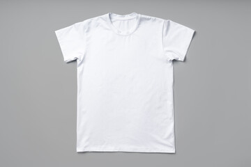 Poster - Cotton T-shirt on gray background flat lay top view